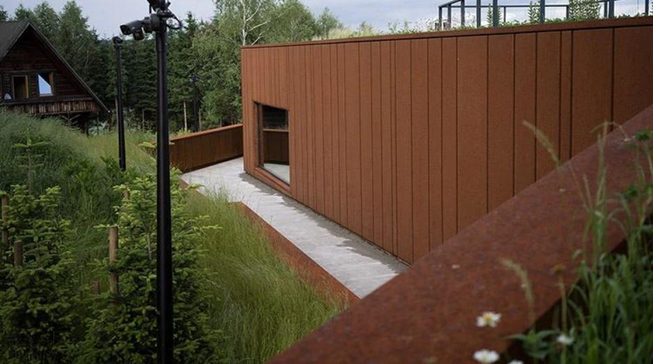 Corten Steel House in Poland: Harmonious Integration with Nature